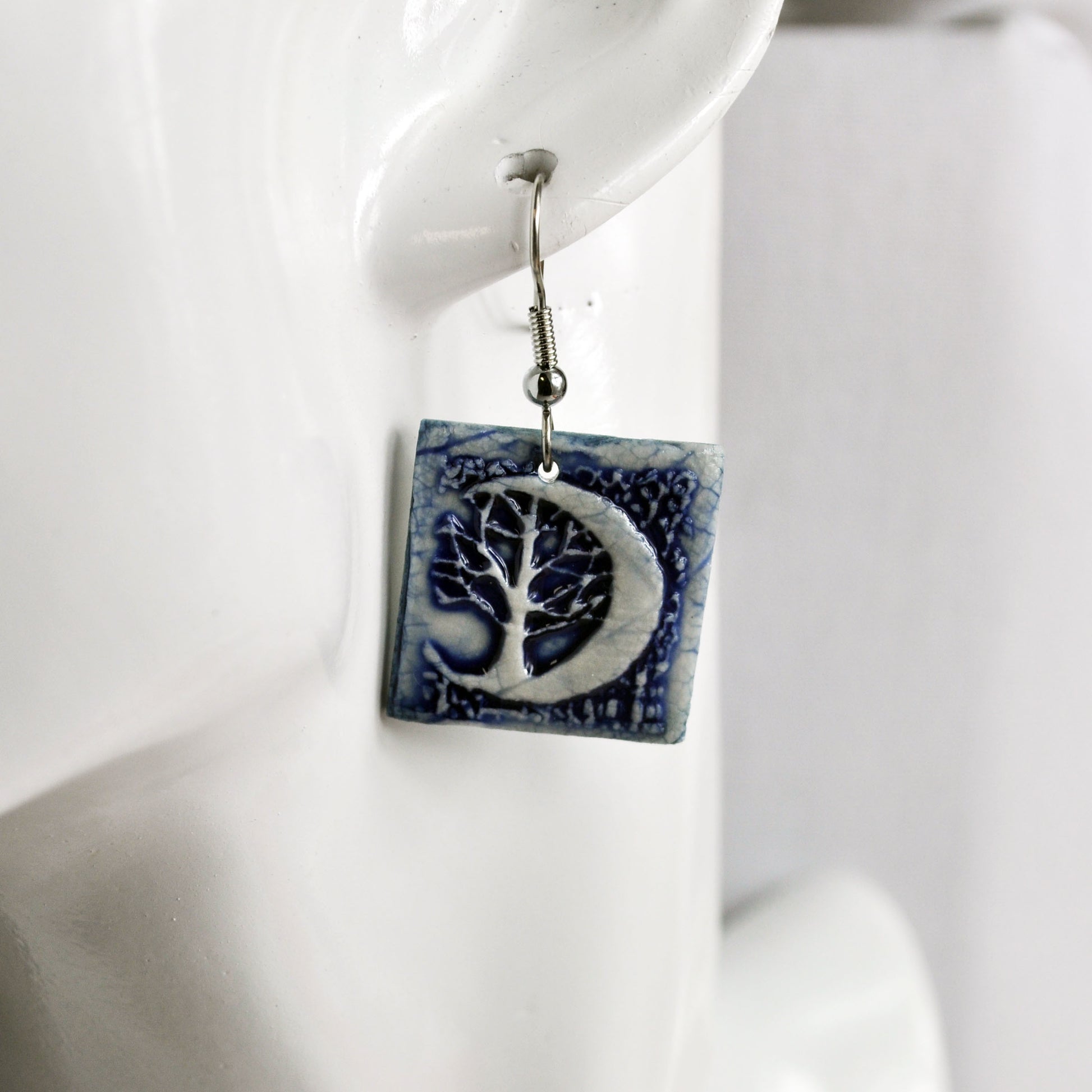 EMS727 Crescent Moon Tree Blue Square Earrings on mann.jpg